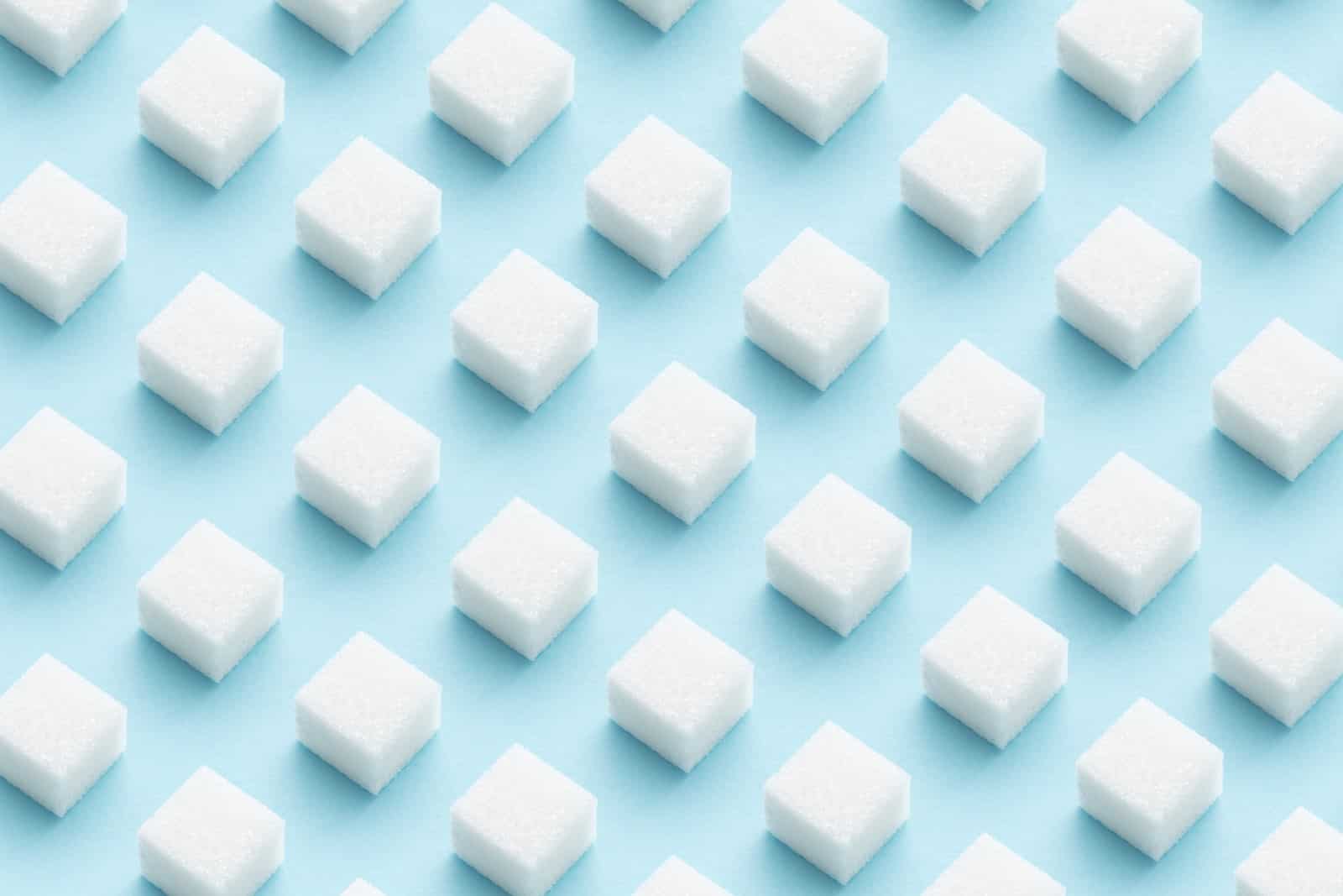 white sugar cubes on blue background